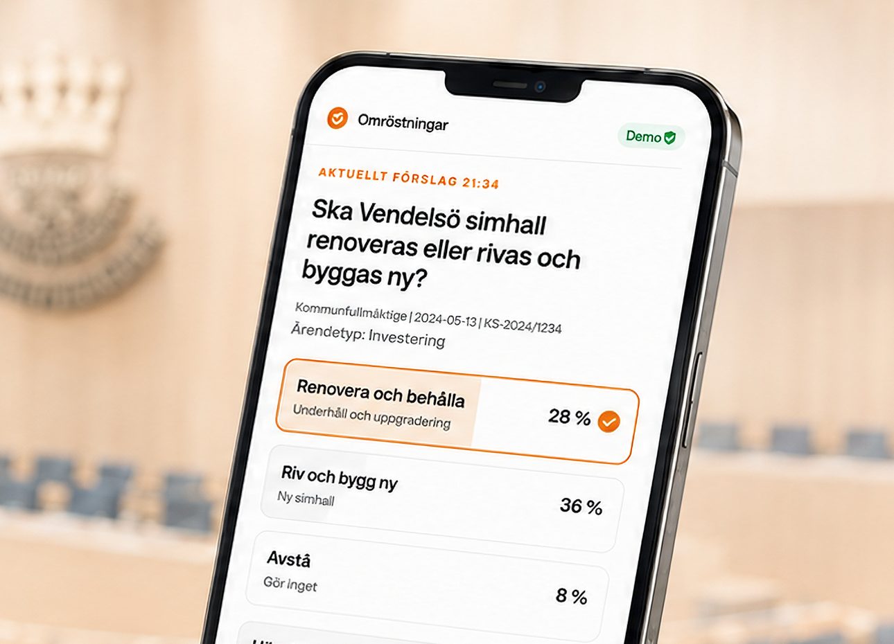 Mobil med Folketsrösts omröstningsvy i en fullmäktigesal, med texten Det är detta vi vill göra